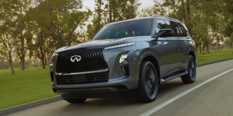 Enjoy the thrill of having your brand-new car or SUV delivered directly to your driveway Nationwide INFINITI Timonium after your purchase is complete. Image of woman walking to INFINITI vehicle.